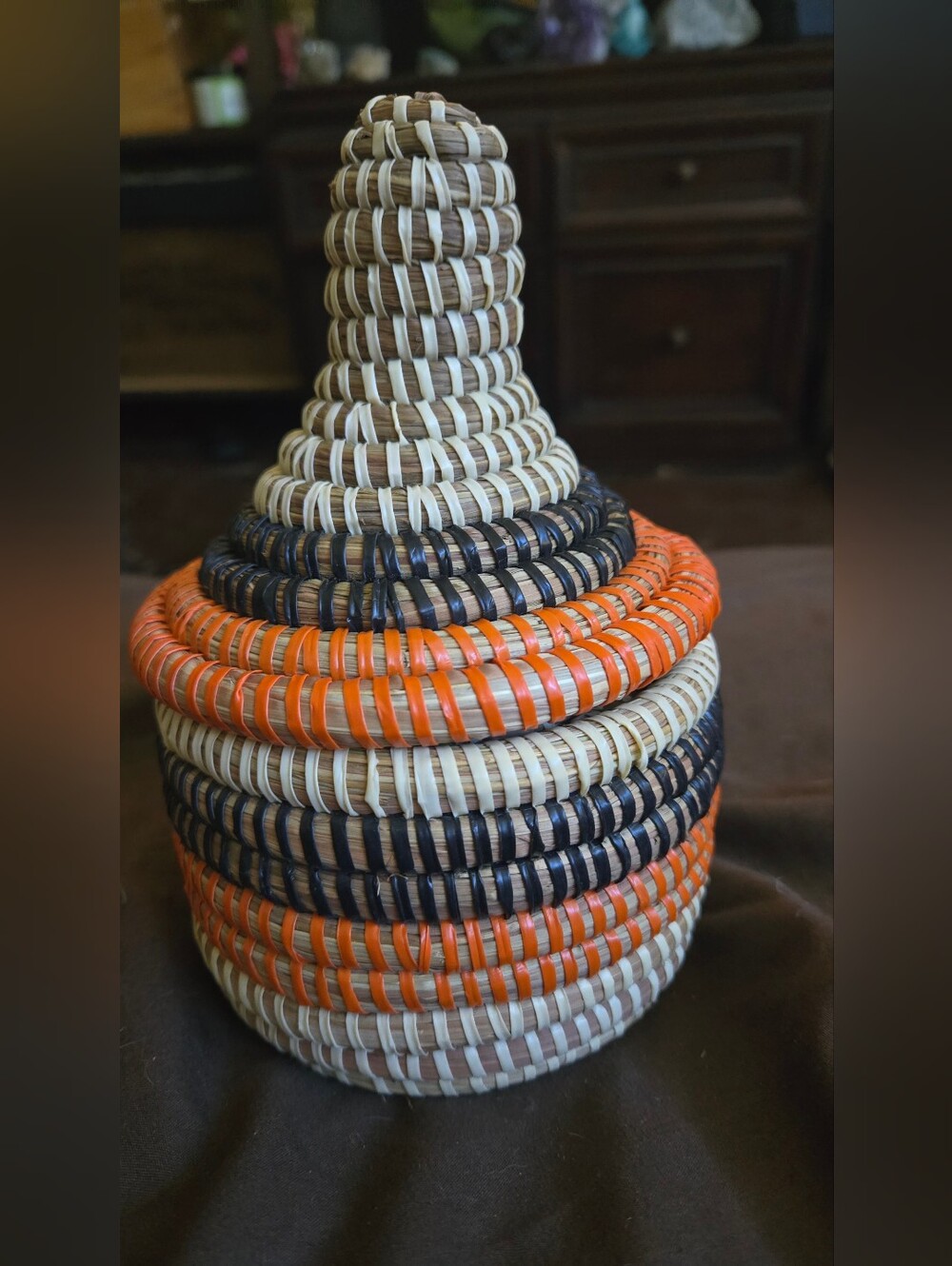 Handwoven Decorative Basket with Orange and Navy Accents